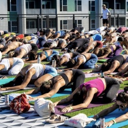 Society Orlando outside people doing yoga