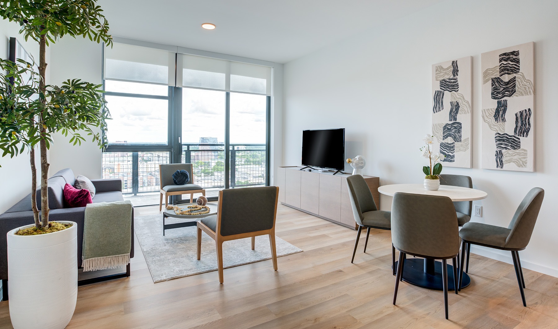 Beautiful living areas to match your lifestyle large living room with furniture a plant and windows