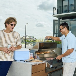 It’s the unofficial last (and long) weekend of summer two men grilling outdoors